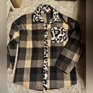 New without tags.  XL button shirt.  More like a shacket.  100% polyester.